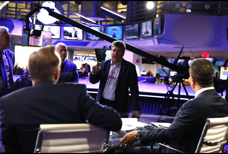 Guy Campanile reviewing coverage with a colleague inside the CBS News newsroom