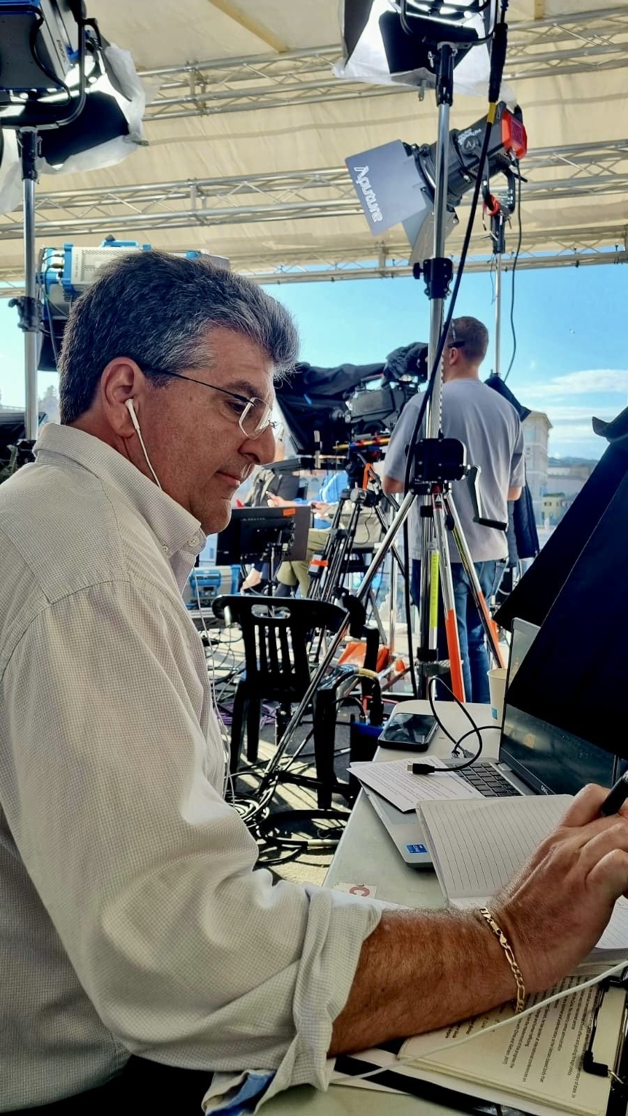 Guy Campanile writing and preparing a script on location